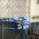 A patient with covid-19 sits in bed in a negative pressure room in the ICU ward at UMass Memorial Medical Center in Worcester, Massachusetts on January 4, 2022.